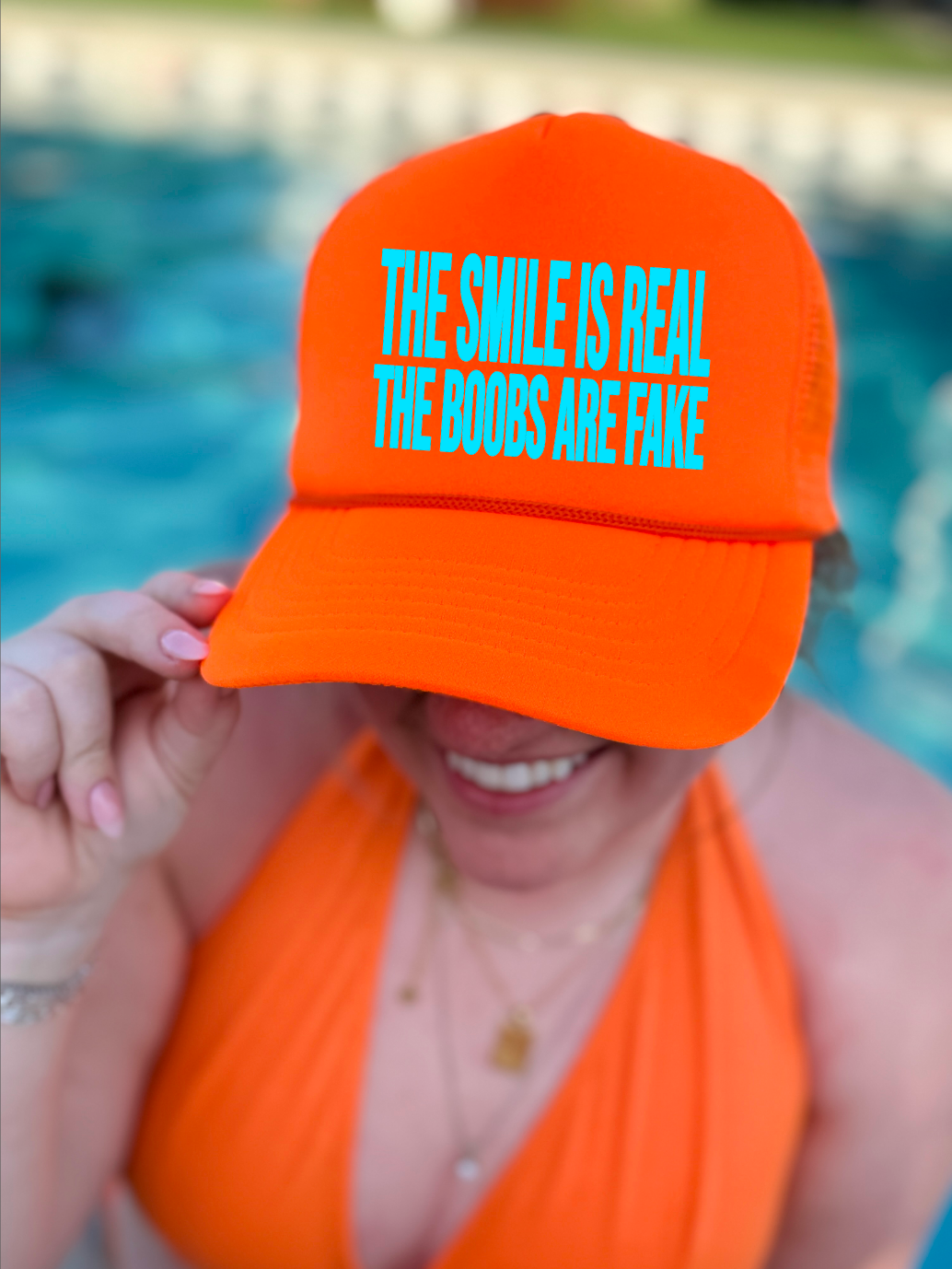 The Smile Is Real The Boobs Are Fake Neon Orange Trucker Hat