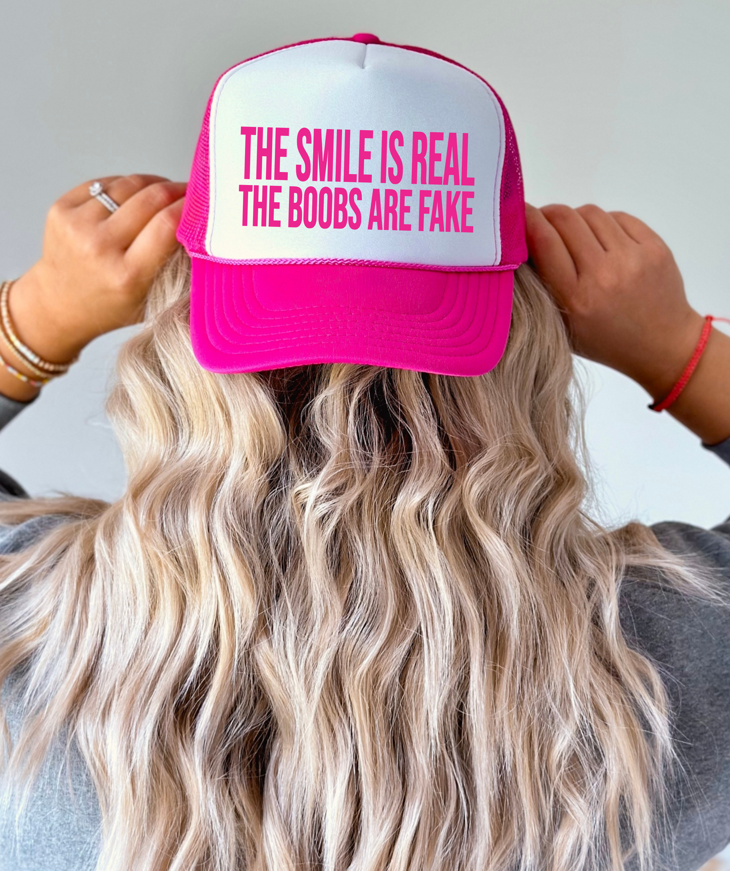 The Smile is Real the Boobs are Fake TRUCKER CAP HOTPNKWHT